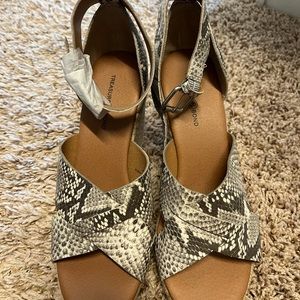 Snake print wedge heel sandals.